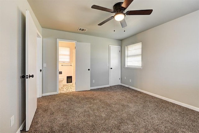 unfurnished bedroom with ceiling fan, ensuite bath, a closet, and carpet floors