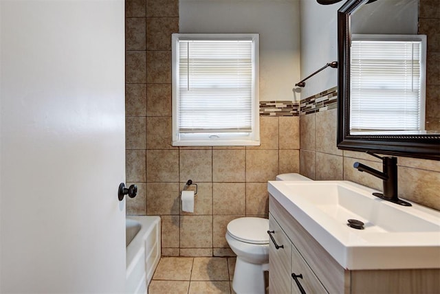 full bathroom with toilet, tile walls, tile patterned floors,  shower combination, and vanity