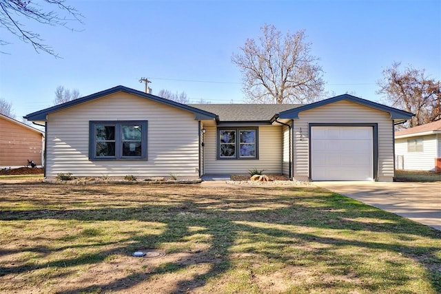 ranch-style house featuring a garage and a front lawn