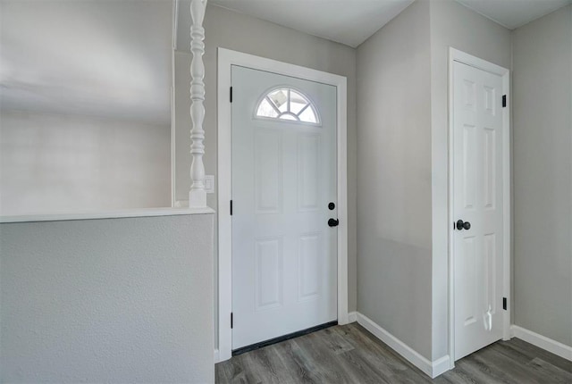 entryway with hardwood / wood-style flooring