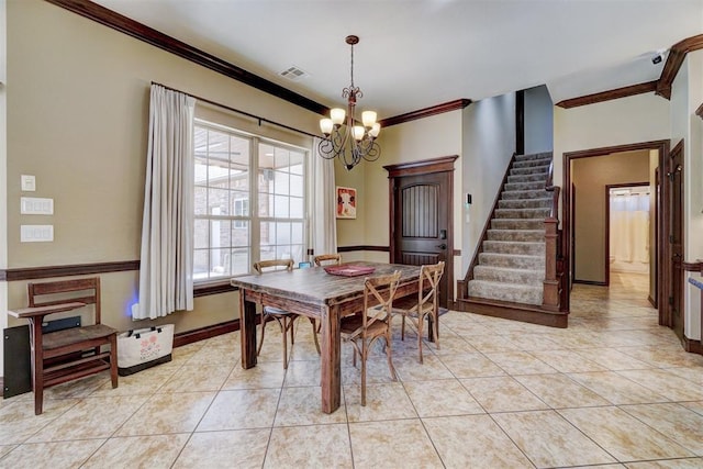 dining area with crown molding, light tile patterned floors, and a notable chandelier