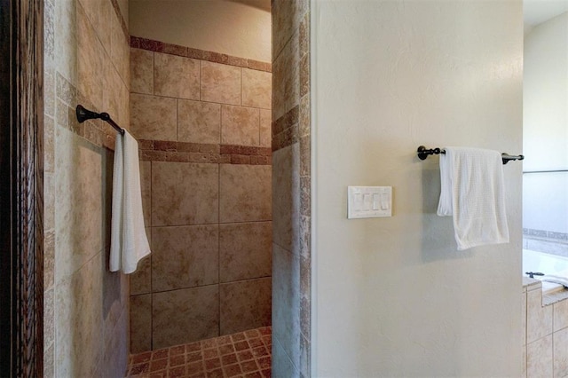 bathroom featuring independent shower and bath