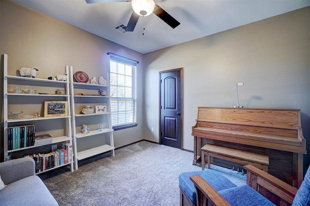 miscellaneous room featuring ceiling fan and carpet