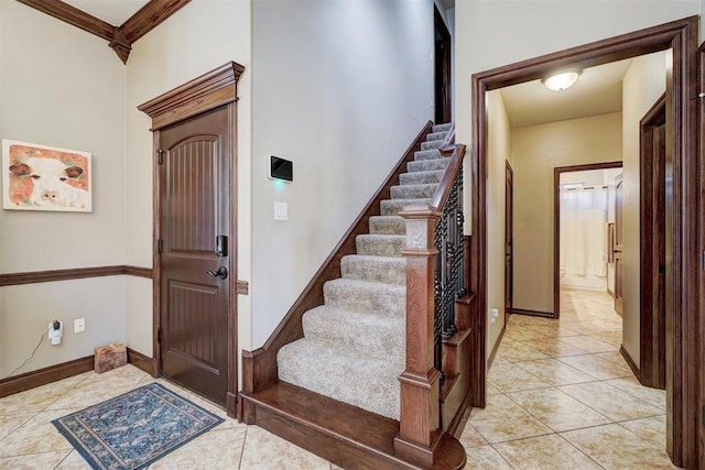 tiled entryway with ornamental molding