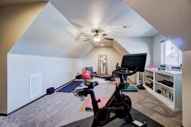 exercise room featuring ceiling fan, lofted ceiling, and carpet floors