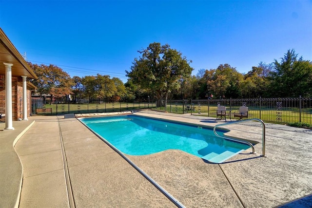 view of swimming pool featuring a patio area