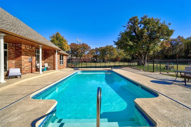 view of swimming pool with a patio