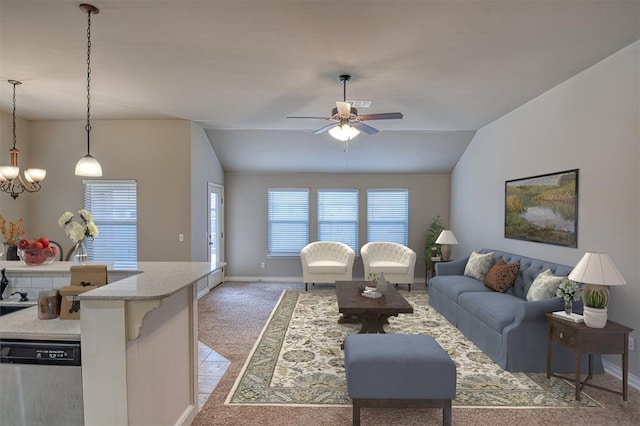 carpeted living room with ceiling fan and lofted ceiling