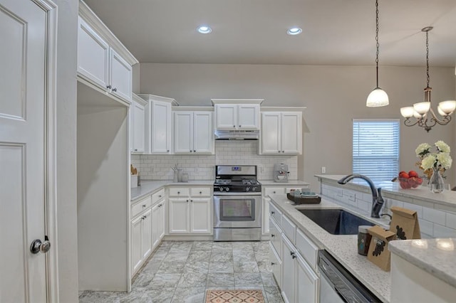 kitchen featuring light stone countertops, tasteful backsplash, white cabinetry, sink, and stainless steel appliances