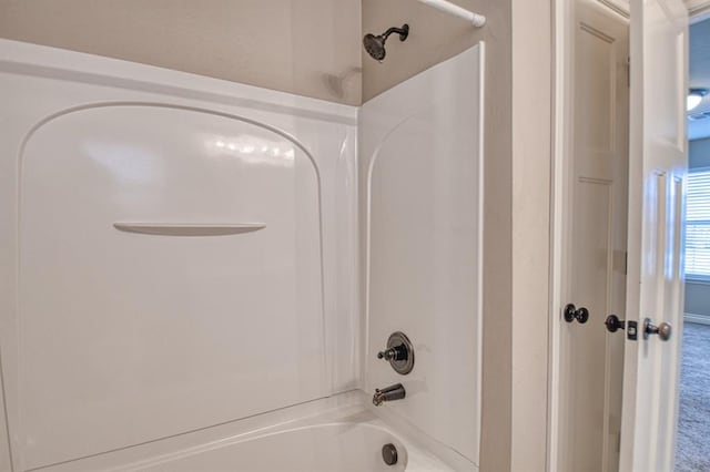 bathroom featuring washtub / shower combination