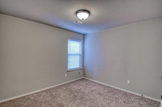 empty room featuring carpet floors