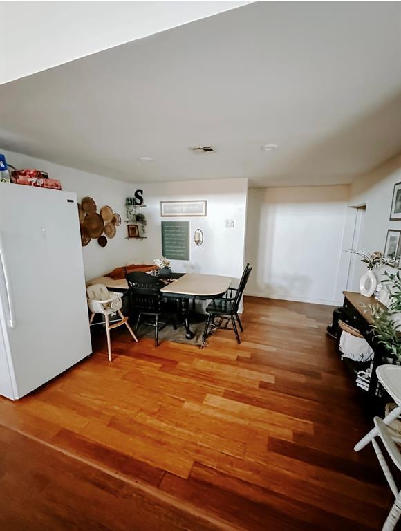 dining room with hardwood / wood-style floors