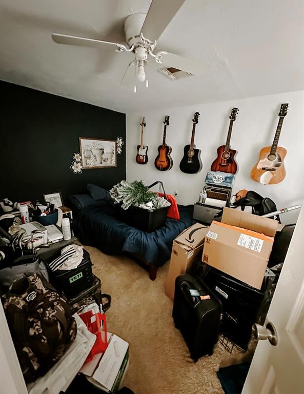 carpeted bedroom featuring ceiling fan