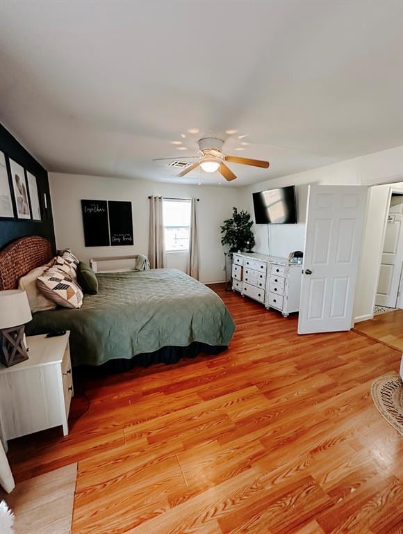 bedroom featuring ceiling fan and light wood-type flooring