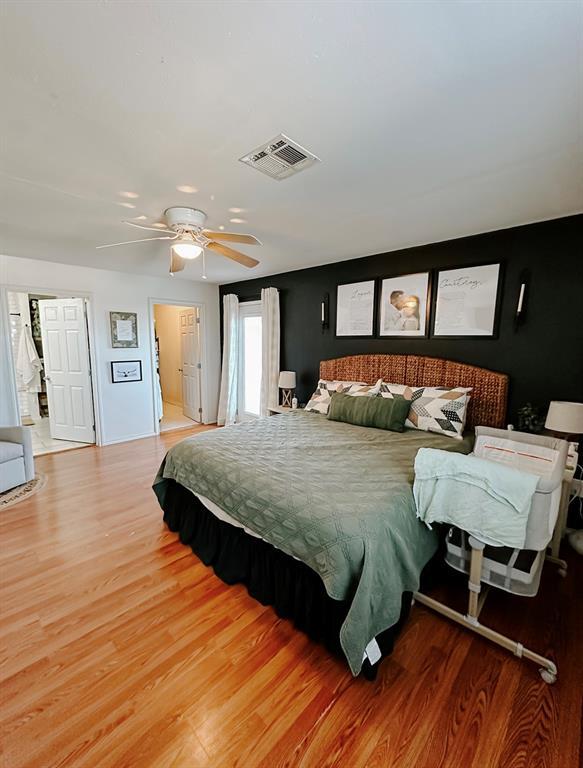 bedroom featuring ceiling fan and hardwood / wood-style flooring