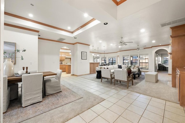 tiled living room featuring ceiling fan and ornamental molding