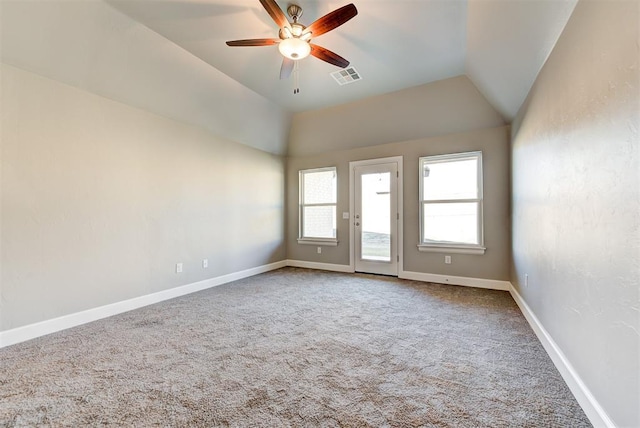 unfurnished room featuring ceiling fan, carpet flooring, and lofted ceiling