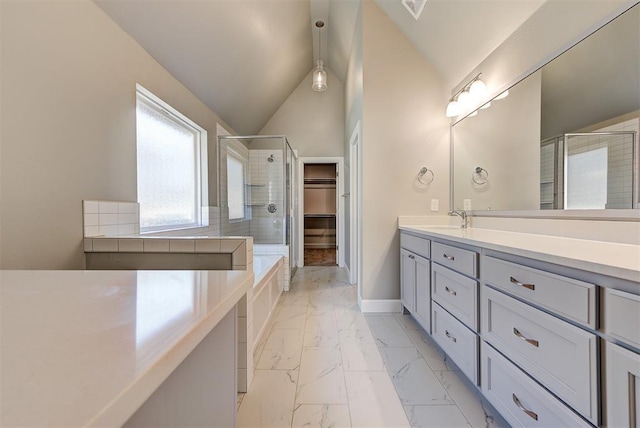 bathroom with a shower with door, vanity, and lofted ceiling