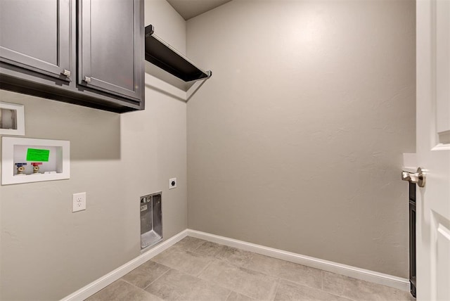 washroom featuring cabinets, hookup for a washing machine, and hookup for an electric dryer