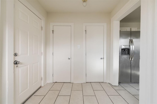 interior space with light tile patterned floors