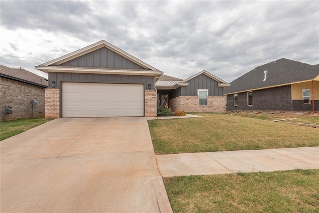 view of front of home featuring a garage and a front lawn