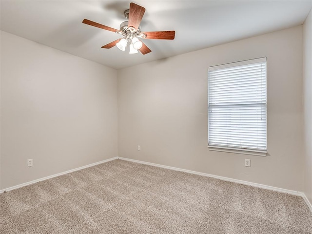 empty room with carpet floors and ceiling fan