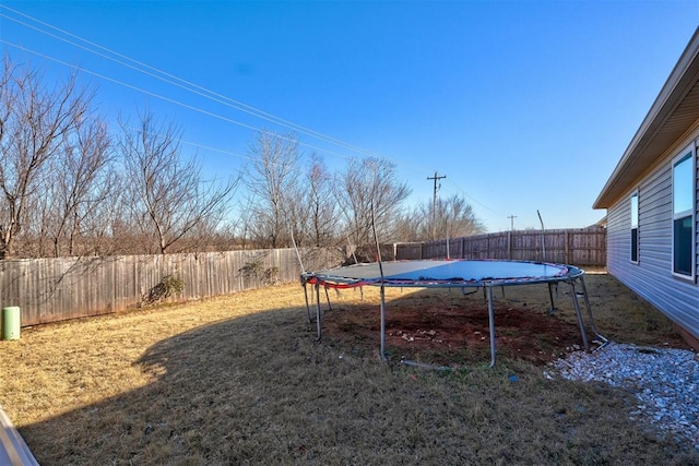 view of yard with a trampoline