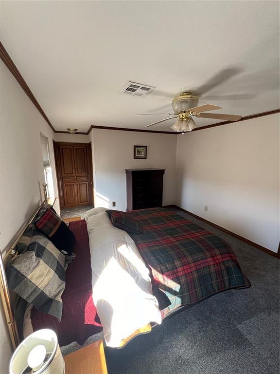 bedroom featuring ceiling fan, carpet floors, visible vents, and crown molding