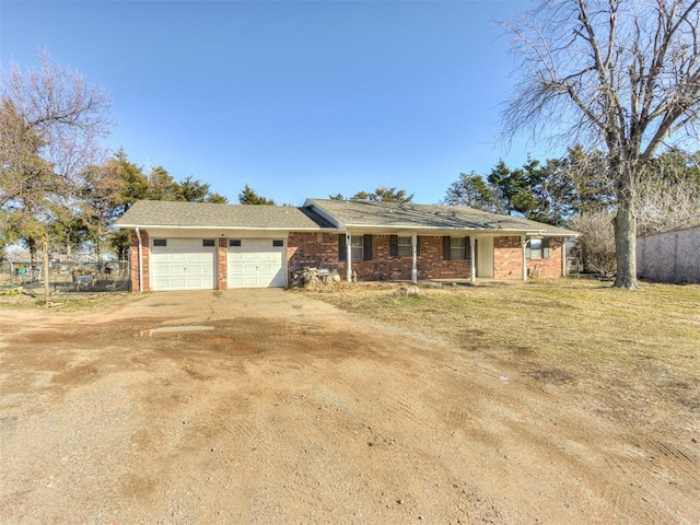 single story home with a front yard and a garage