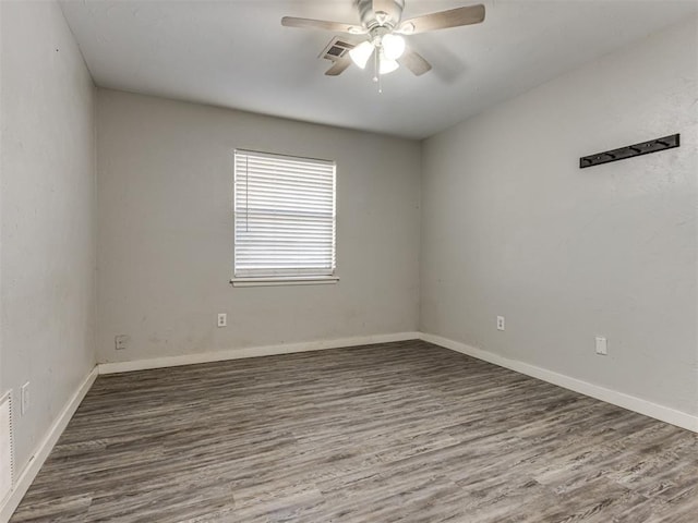 empty room featuring ceiling fan and wood-type flooring