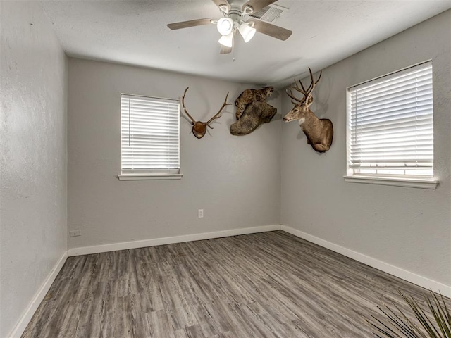 unfurnished room featuring ceiling fan and hardwood / wood-style floors