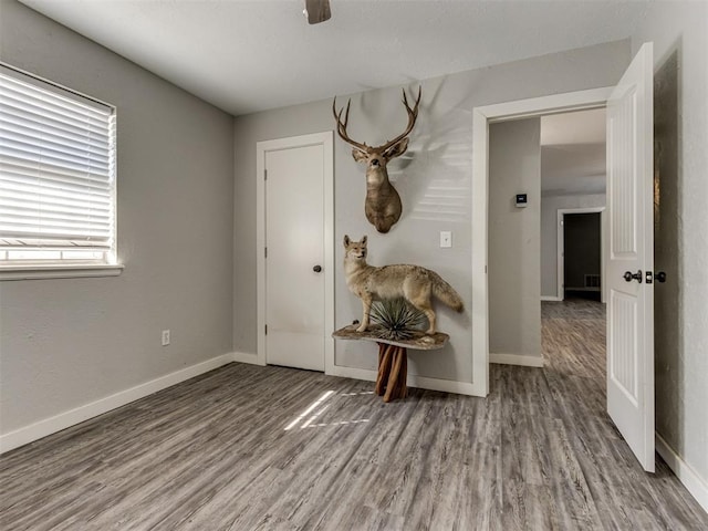 empty room with wood-type flooring