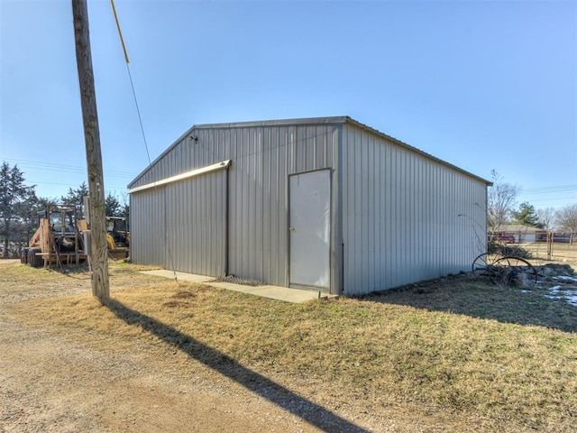 view of outbuilding with a lawn