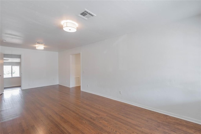 empty room with dark hardwood / wood-style floors