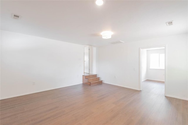 unfurnished living room with wood-type flooring