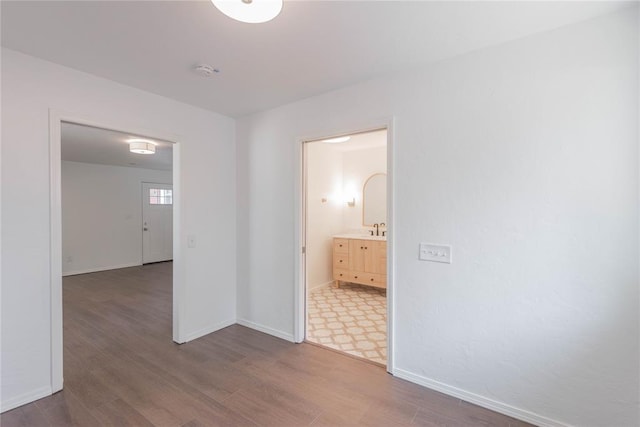 interior space featuring sink and hardwood / wood-style floors