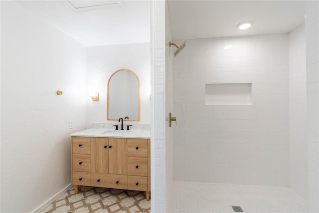 bathroom featuring vanity and a tile shower