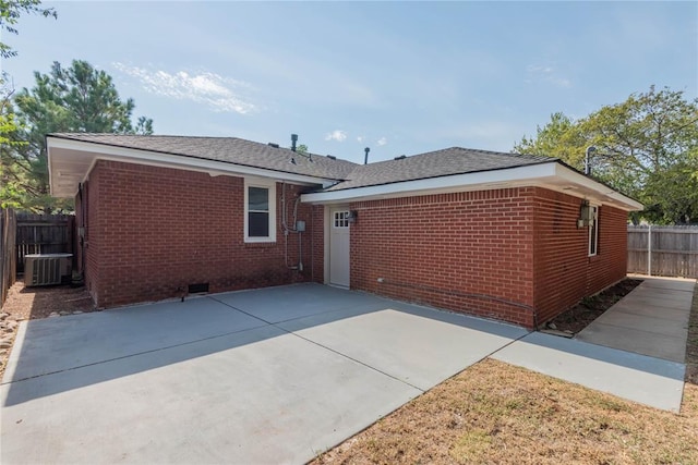 rear view of property featuring a patio area and central AC unit