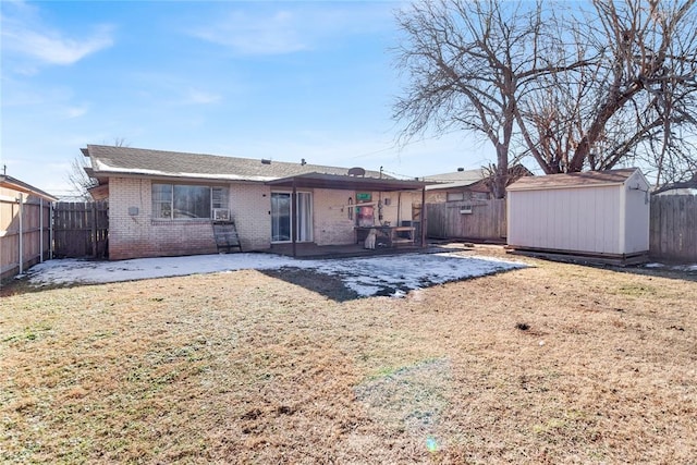 rear view of house with a storage shed and a patio