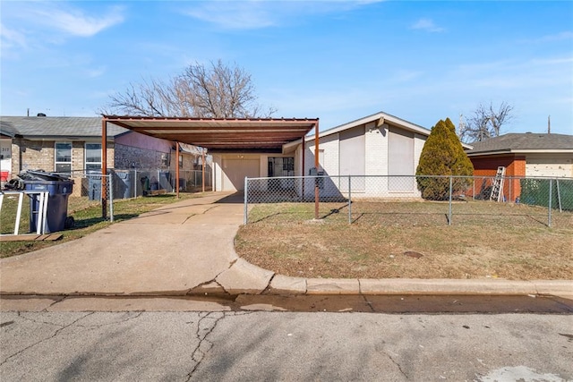 view of front of property with a front lawn and a carport