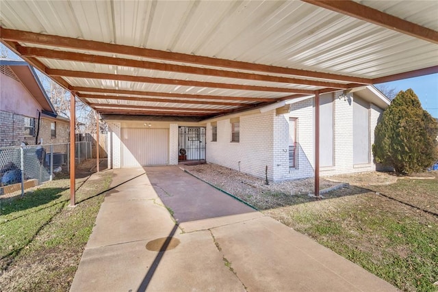 entrance to property featuring a carport and central AC unit