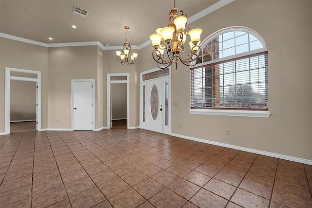 tiled entryway with a high ceiling, a chandelier, and ornamental molding