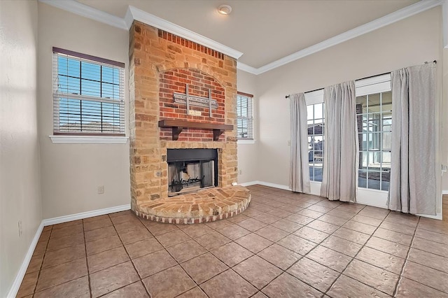 unfurnished living room with a brick fireplace, ornamental molding, and tile patterned flooring