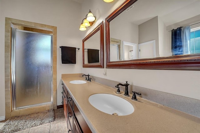 bathroom featuring an enclosed shower, vanity, and tile patterned floors