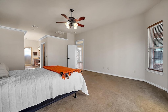 bedroom featuring ceiling fan, ensuite bathroom, and carpet flooring