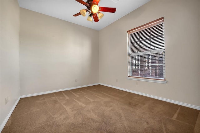 spare room with carpet floors and ceiling fan