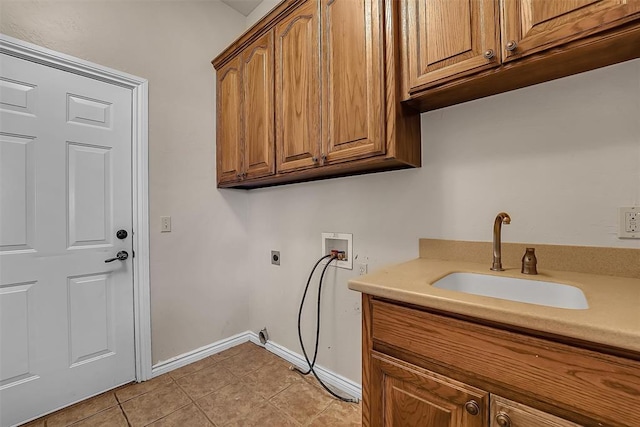 laundry room with sink, washer hookup, light tile patterned floors, hookup for an electric dryer, and cabinets