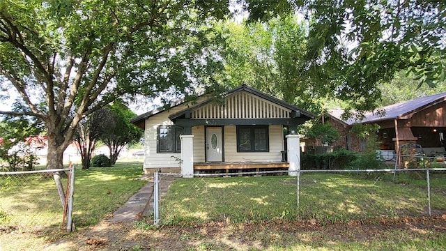 bungalow-style home featuring a front lawn and a porch