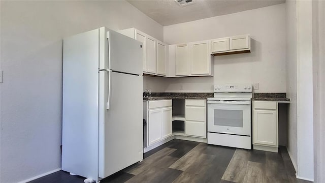 kitchen with white cabinetry, dark wood-type flooring, and white appliances