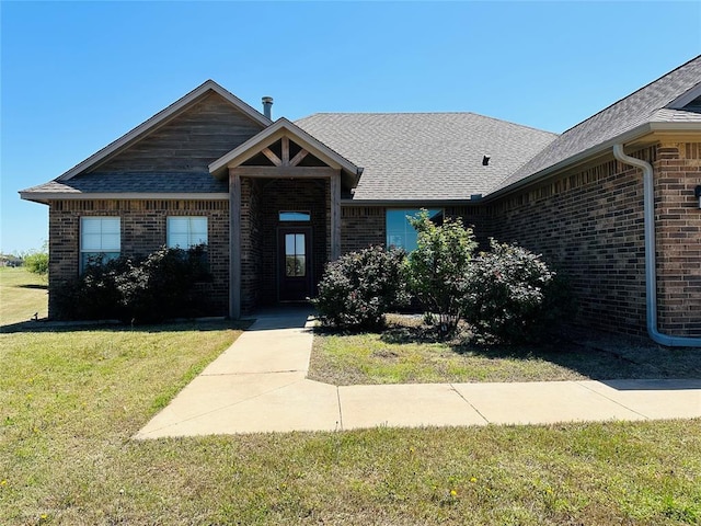 view of front of home with a front lawn